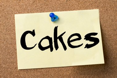 Kek - yapışkanlı etiket bulletin board tutturulmuş.