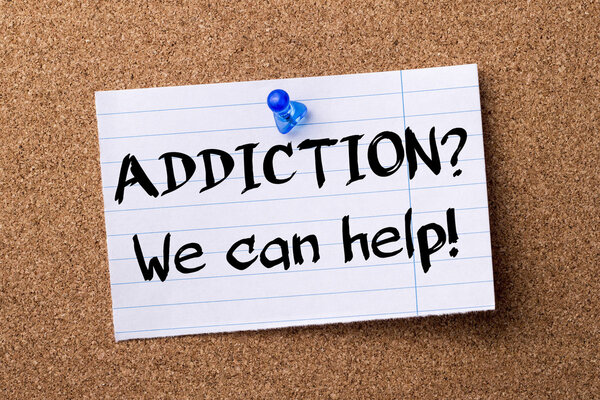 ADDICTION? We can help! - teared note paper pinned on bulletin b