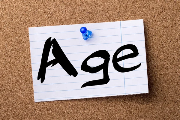 Age - teared note paper pinned on bulletin board — Stock Photo, Image