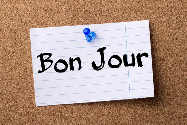 Bon Jour - teared note paper pinned on bulletin board — Stock Photo, Image