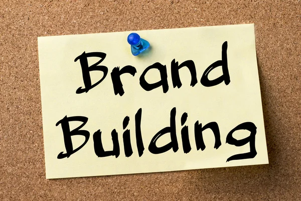 Brand Building - adhesive label pinned on bulletin board — Stock Photo, Image