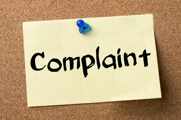 Complaint - adhesive label pinned on bulletin board