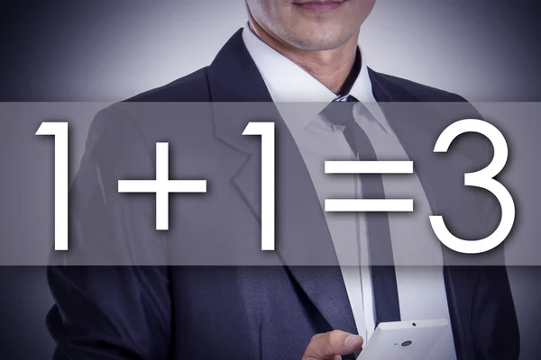 1 plus 1 equal 3 - plus one free  - Young businessman with text — Stock Photo, Image