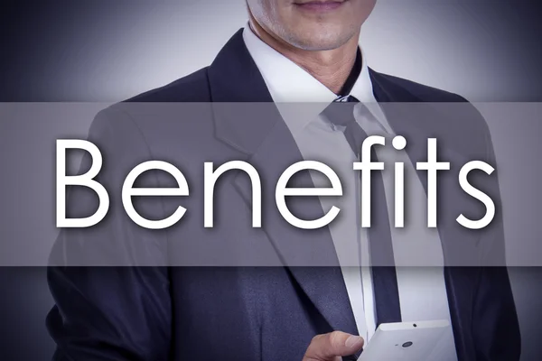 Benefits - Young businessman with text - business concept — Stock Photo, Image