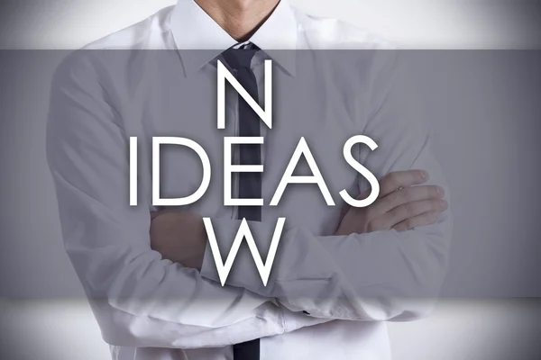 NEW IDEAS cross - Joven hombre de negocios con texto - concepto de negocio —  Fotos de Stock