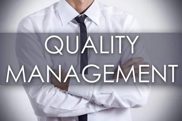 QUALITY MANAGEMENT - Young businessman with text - business conc — Stock Photo, Image