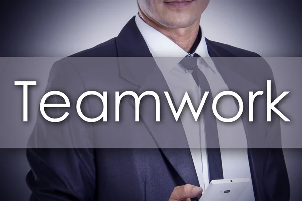 Teamwork - ung affärsman med text - affärsidé — Stockfoto