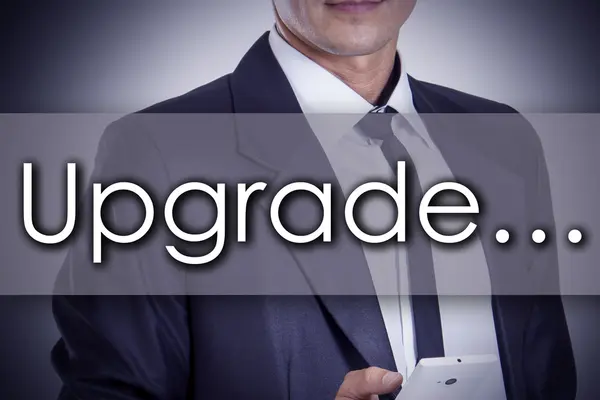 Upgrade... - Giovane imprenditore con testo - concetto di business — Foto Stock