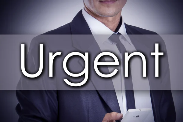 Urgent - Young businessman with text - business concept — Stock Photo, Image