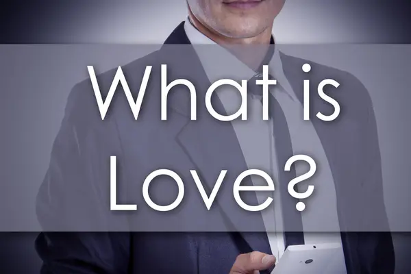 What is Love? - Young businessman with text - business concept — Zdjęcie stockowe