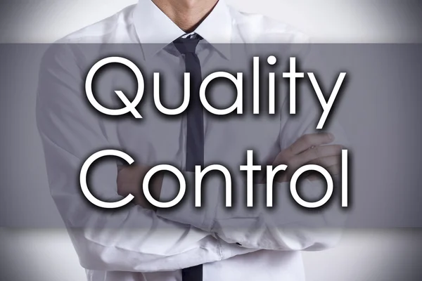 Quality Control - Young businessman with text - business concept — Stock Photo, Image