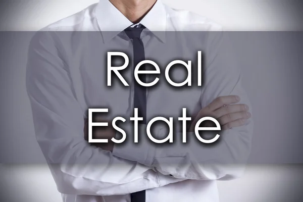 Real Estate - νεαρός επιχειρηματίας με κείμενο - επιχειρηματική ιδέα — Φωτογραφία Αρχείου