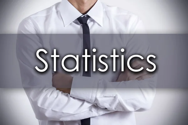 Statystyki - młody biznesmen z tekstem - koncepcja biznesowa — Zdjęcie stockowe