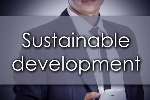 Desenvolvimento sustentável - Jovem empresário com texto - negócios — Fotografia de Stock