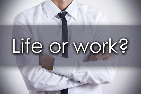 Leven of werk? -Jonge zakenman met tekst - bedrijfsconcept — Stockfoto