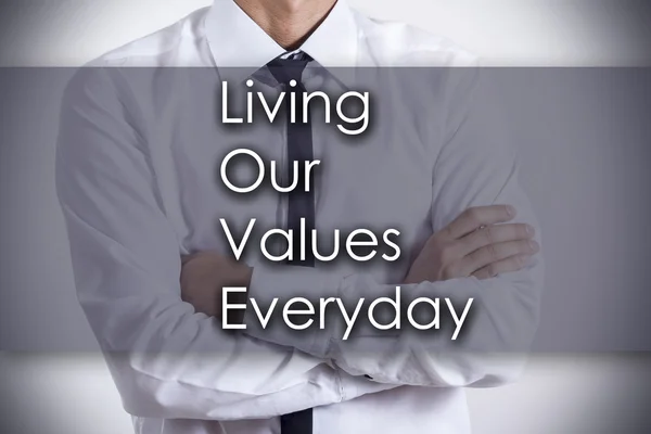 Unsere Werte leben tägliche Liebe - junger Geschäftsmann mit Text - — Stockfoto