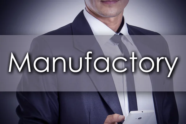 Manufactory - Young businessman with text - business concept — Stock Photo, Image