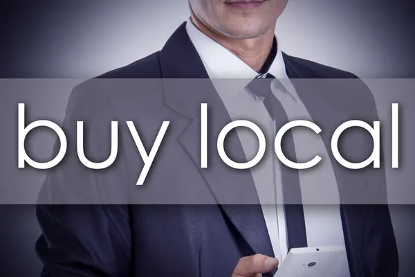 Buy local - Young businessman with text - business concept — Stock Photo, Image