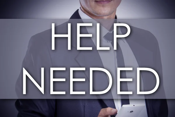 Hjälp behövs - ung affärsman med text - affärsidé — Stockfoto