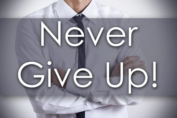 Never Give Up! - Young businessman with text - business concept — Stock Photo, Image