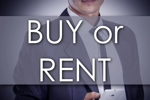 BUY or RENT - Young businessman with text - business concept — Stock Photo, Image