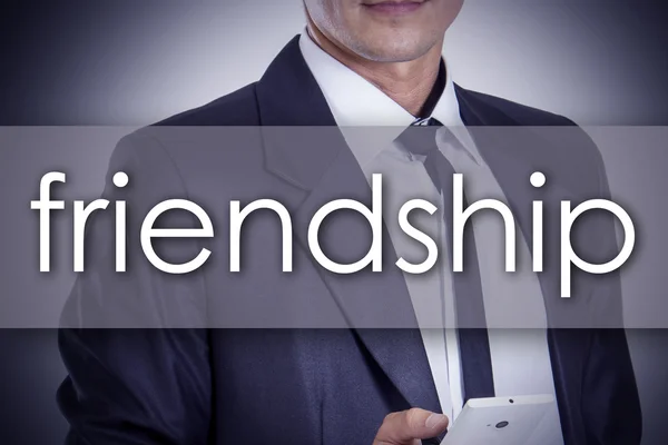FRIENDSHIP - молодий бізнесмен з текстом - бізнес-концепція — стокове фото