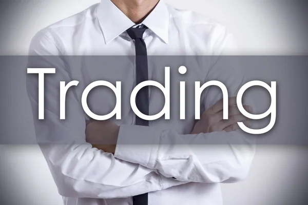 Trading - Young businessman with text - business concept — Stock Photo, Image