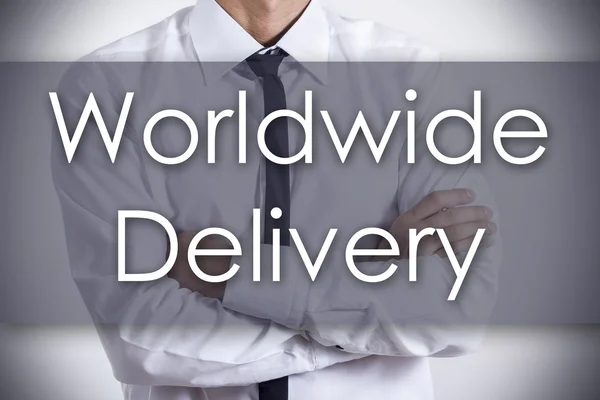 Worldwide Delivery - Young businessman with text - business conc — Stock Photo, Image