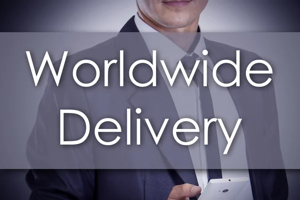 Worldwide Delivery - Ung forretningsmand med tekst - forretningskoncept - Stock-foto