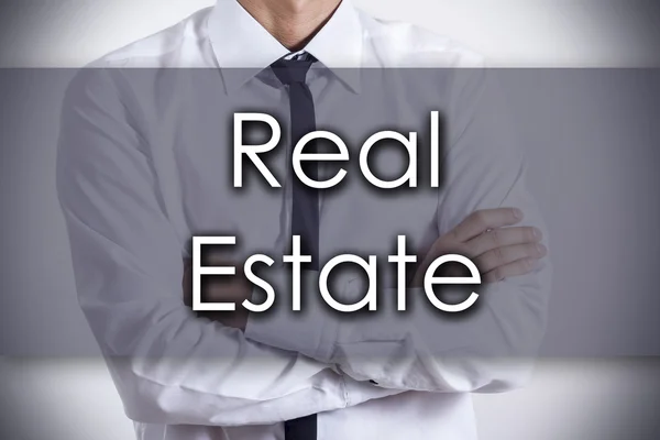 Real Estate - mladý podnikatel s textem - obchodní koncept — Stock fotografie