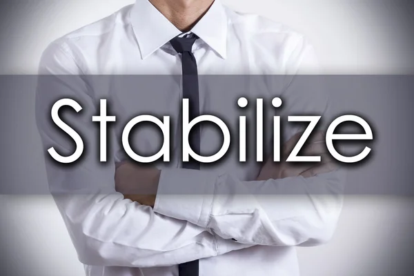 Stabilize - Young businessman with text - business concept — Stock Photo, Image