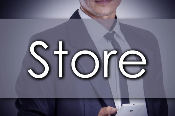 Store - Young businessman with text - business concept — Stock Photo, Image