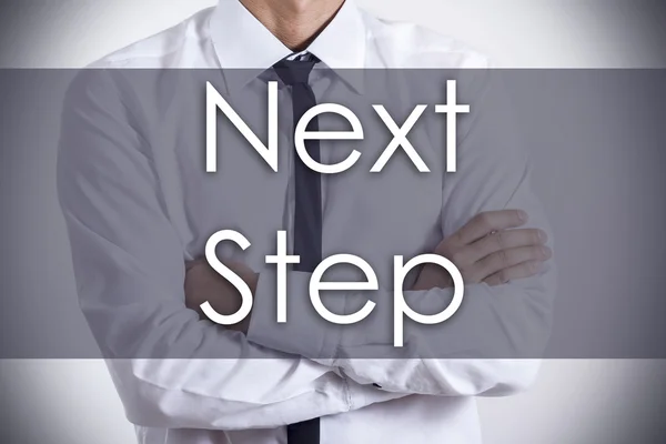 Next Step - Young businessman with text - business concept — Stock Photo, Image
