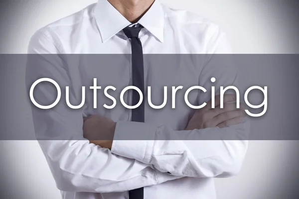 Outsourcing - Joven empresario con texto - concepto de negocio — Foto de Stock