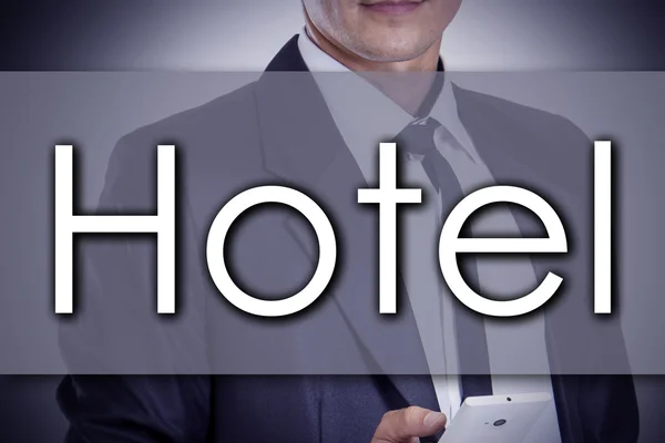 Hotel - jonge zakenman met tekst - bedrijfsconcept — Stockfoto