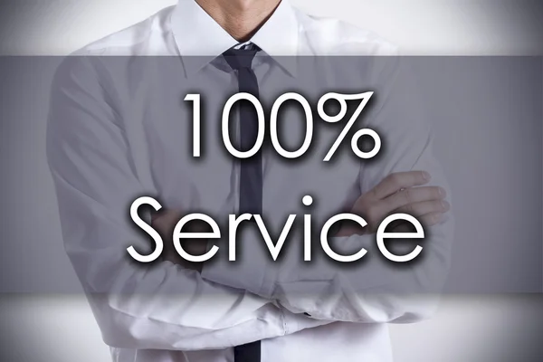 100% сервис - Молодой бизнесмен с текстовой - бизнес-концепцией — стоковое фото