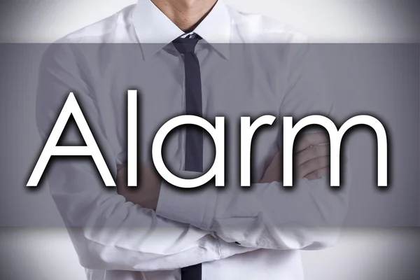 Alarm - jonge zakenman met tekst - bedrijfsconcept — Stockfoto