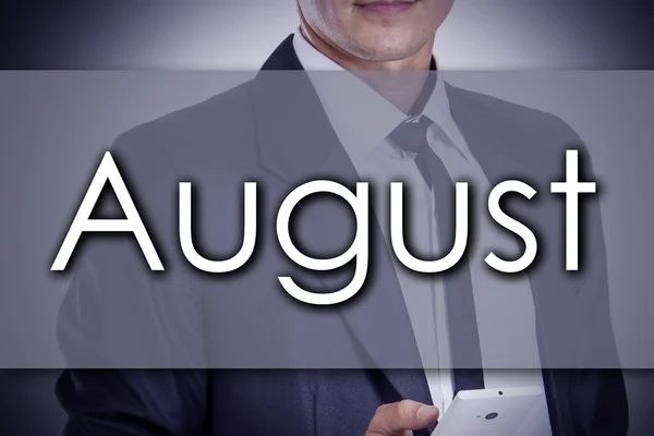Augustus - jonge zakenman met tekst - bedrijfsconcept — Stockfoto