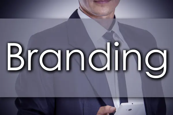 Branding - Young businessman with text - business concept — Stock Photo, Image