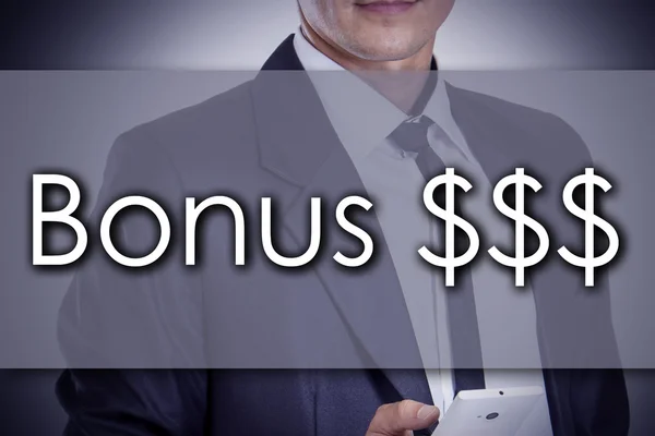 Bonus $$$ - Young businessman with text - business concept — Stock Photo, Image