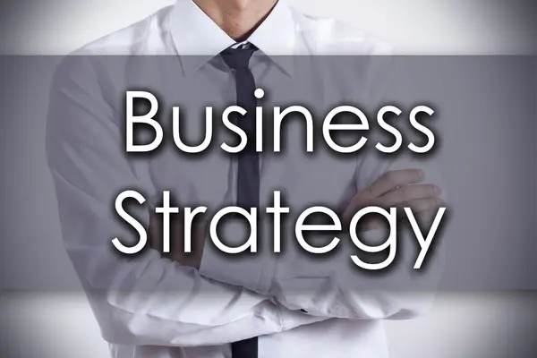 Biznesowych strategii - młody biznesmen z tekstem - biznes koncer — Zdjęcie stockowe