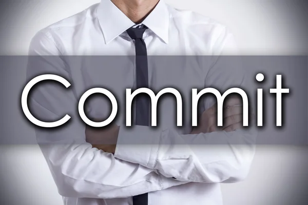 Commit - ung affärsman med text - affärsidé — Stockfoto