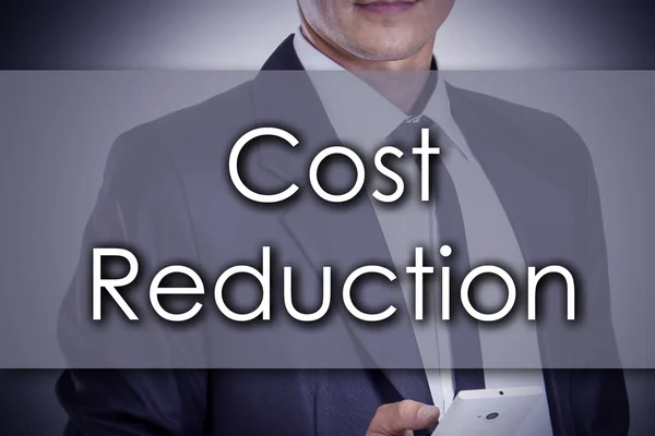 Koszt redukcji - młody biznesmen z tekstem - koncepcja biznesowa — Zdjęcie stockowe