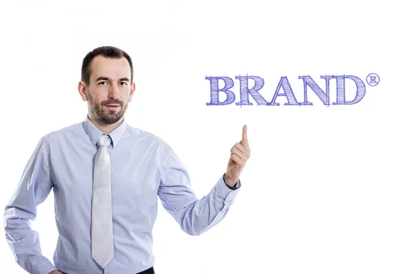 Brand (R)  - Young businessman pointing up — Stock Photo, Image