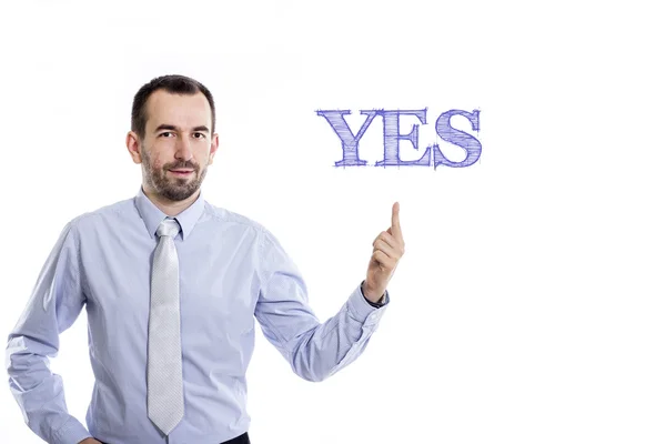 Yes  - Young businessman pointing up Stock Image