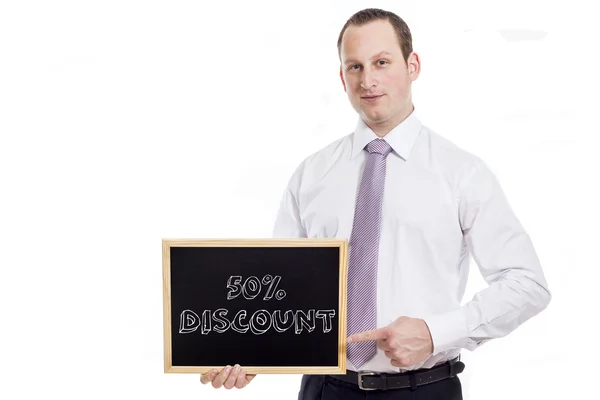 50 procent rabatt - ung affärsman med blackboard — Stockfoto