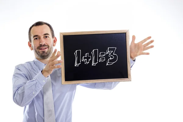 1 plus 1 equal 3  - Young businessman with blackboard — Stock Photo, Image