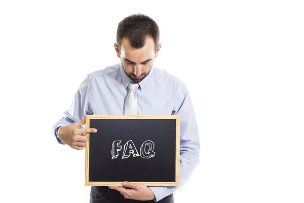 FAQ - mladý podnikatel s tabule — Stock fotografie