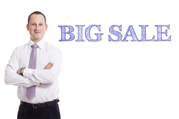 Big sale - Young businessman with blue text — Stock Photo, Image