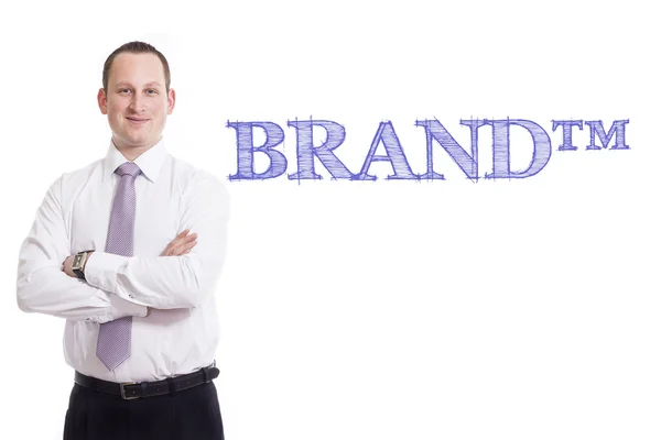 BRAND tm - Young businessman with blue text — Stock Photo, Image